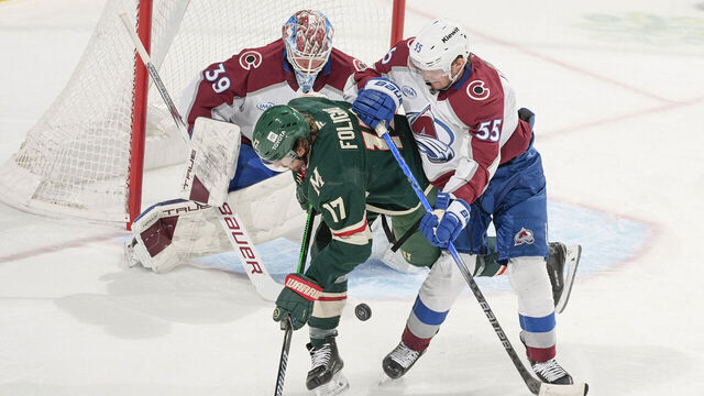 SAINT PAUL, MN - MARCH 11: Ryan Lindgren #55 and MacKenzie Blackwood #39 of the Colorado Avalanche defend their goal against Marcus Foligno #17 of the Minnesota Wild during the game at the Xcel Energy Center on March 11, 2025 in Saint Paul, Minnesota.
