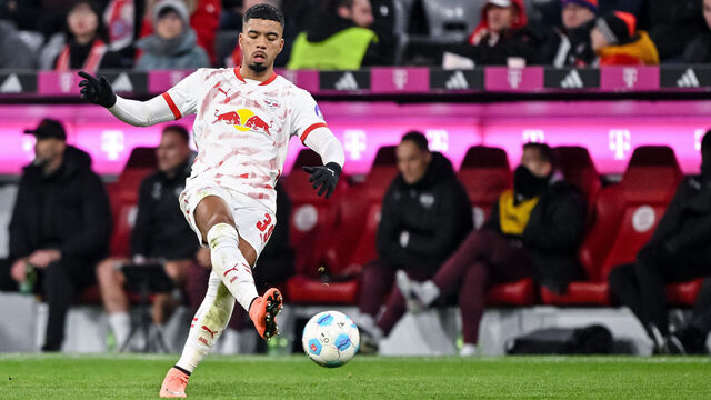 Munich, Germany - December 20: Benjamin Henrichs of RB Leipzig controls the Ball during the Bundesliga match between FC Bayern München and RB Leipzig at Allianz Arena on December 20, 2024 in Munich, Germany.