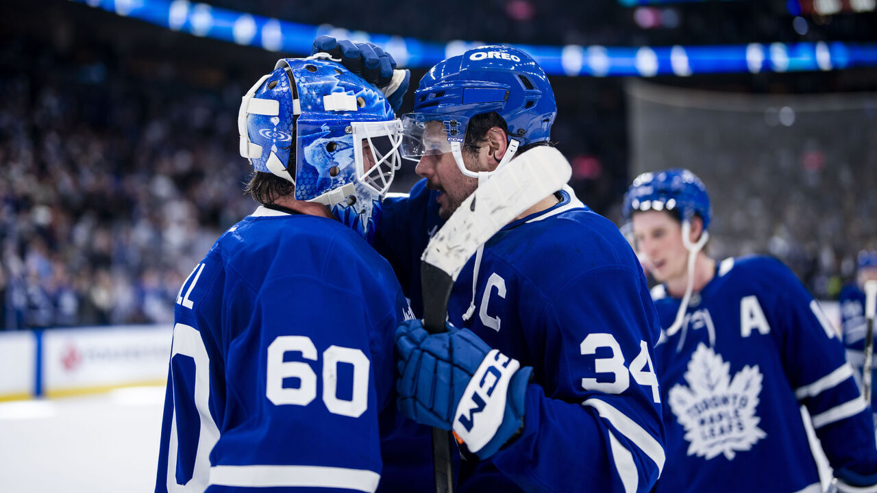 TORONTO, ON - MARCH 19: Auston Matthews #34 congratulates Joseph Woll #60 of the Toronto Maple Leafs on a win over the Colorado Avalanche at the Scotiabank Arena on March 19, 2025 in Toronto, Ontario, Canada.