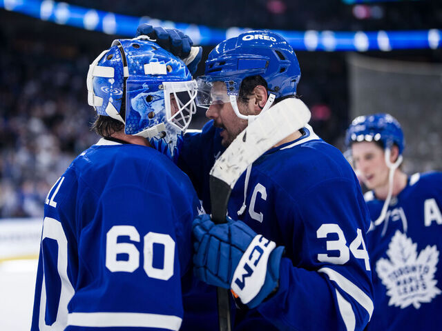TORONTO, ON - MARCH 19: Auston Matthews #34 congratulates Joseph Woll #60 of the Toronto Maple Leafs on a win over the Colorado Avalanche at the Scotiabank Arena on March 19, 2025 in Toronto, Ontario, Canada.