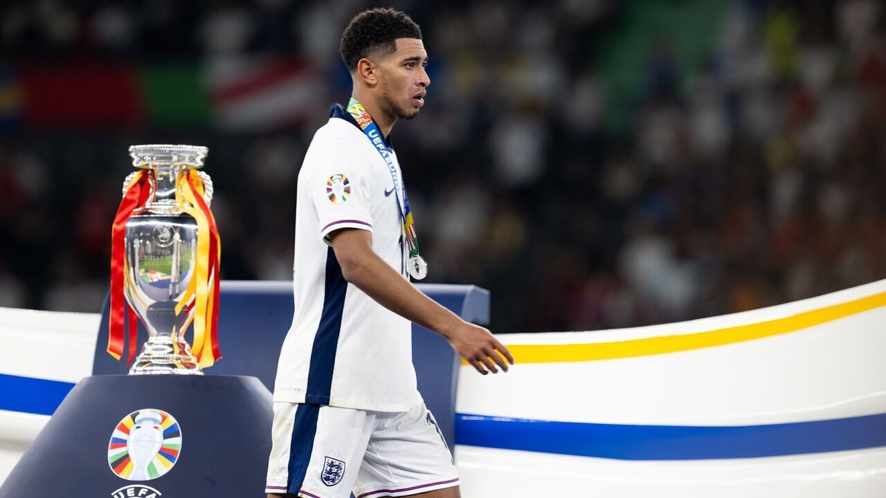 Jude Bellingham of England wearing his silver medal walks past the trophy during the awarding ceremony after the UEFA Euro 2024 final match between England and Spain in Berlin, Germany, July 14, 2024.