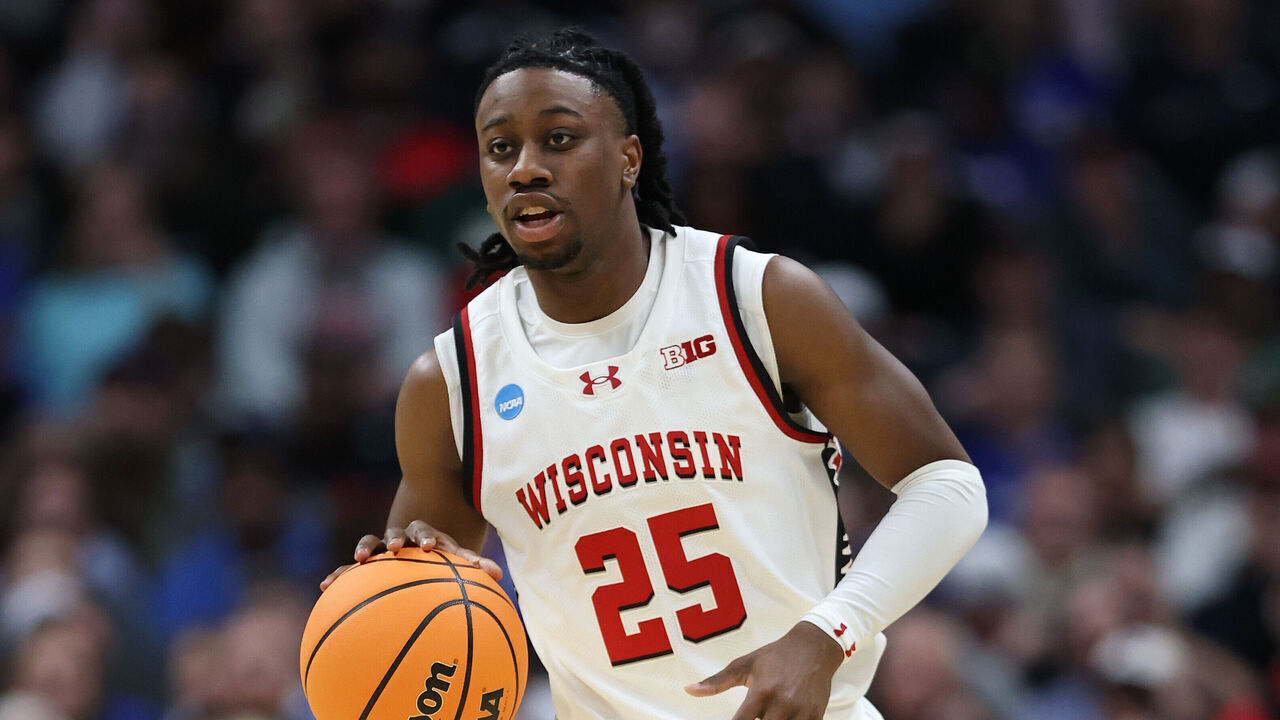 DENVER, COLORADO - MARCH 20: John Blackwell #25 of the Wisconsin Badgers dribbles the ball against the Montana Grizzlies during the second half at Ball Arena on March 20, 2025 in Denver, Colorado.