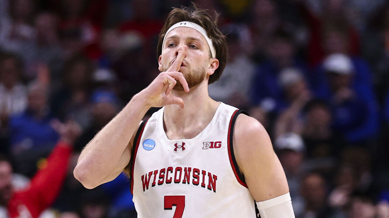 DENVER, COLORADO - MARCH 20: Carter Gilmore #7 of the Wisconsin Badgers reacts after a play against the Montana Grizzlies during the first round of the 2025 NCAA Men's Basketball Tournament held at Ball Arena on March 20, 2025 in Denver, Colorado.