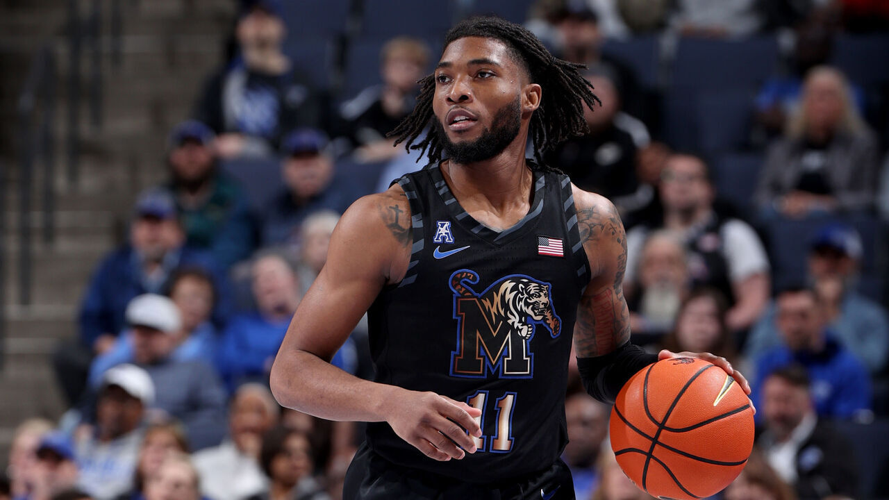 MEMPHIS, TN - FEBRUARY 26: Tyrese Hunter #11 of the Memphis Tigers dribbles the ball against the Rice Owls during the second half on February 26, 2025 at FedExForum in Memphis, Tennessee.