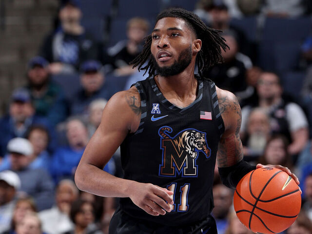 MEMPHIS, TN - FEBRUARY 26: Tyrese Hunter #11 of the Memphis Tigers dribbles the ball against the Rice Owls during the second half on February 26, 2025 at FedExForum in Memphis, Tennessee.