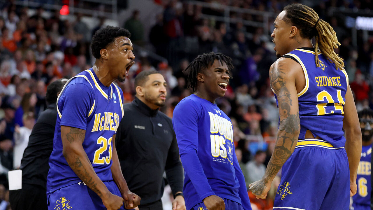 PROVIDENCE, RHODE ISLAND - MARCH 20: Brandon Murray #23 and Christian Shumate #24 of the McNeese State Cowboys celebrate against the Clemson Tigers during the first half in the first round of the NCAA Men's Basketball Tournament at Amica Mutual Pavillion on March 20, 2025 in Providence, Rhode Island.