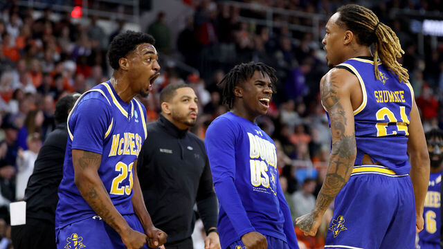 PROVIDENCE, RHODE ISLAND - MARCH 20: Brandon Murray #23 and Christian Shumate #24 of the McNeese State Cowboys celebrate against the Clemson Tigers during the first half in the first round of the NCAA Men's Basketball Tournament at Amica Mutual Pavillion on March 20, 2025 in Providence, Rhode Island.