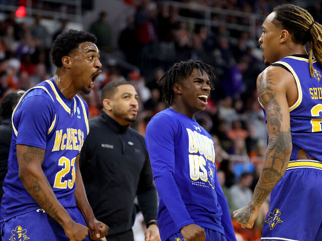 PROVIDENCE, RHODE ISLAND - MARCH 20: Brandon Murray #23 and Christian Shumate #24 of the McNeese State Cowboys celebrate against the Clemson Tigers during the first half in the first round of the NCAA Men's Basketball Tournament at Amica Mutual Pavillion on March 20, 2025 in Providence, Rhode Island.