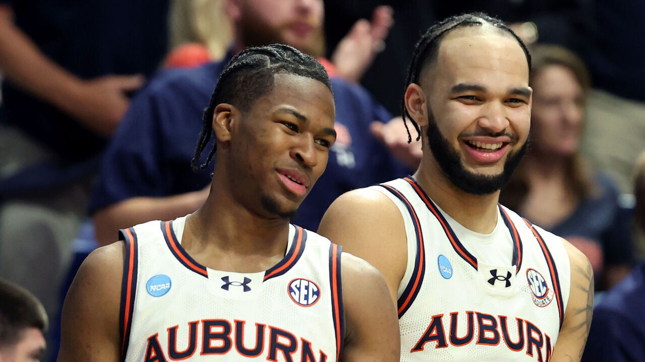 LEXINGTON, KENTUCKY - MARCH 20: Miles Kelly #13 and Johni Broome #4 of the Auburn Tigers react during the second half against the Alabama State Hornets in the first round of the NCAA Men's Basketball Tournament at Rupp Arena on March 20, 2025 in Lexington, Kentucky.