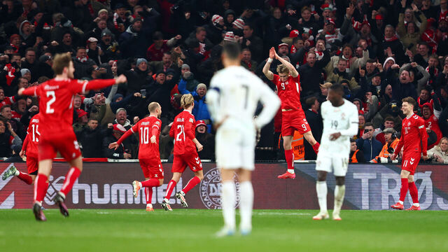 COPENHAGEN, DENMARK - MARCH 20: Rasmus Hojlund of Denmark celebrates scoring his team's first goal whilst Cristiano Ronaldo of Portugal (obscured) looks on during the UEFA Nations League quarterfinal leg one match between Denmark and Portugal at Parken Stadium on March 20, 2025 in Copenhagen, Denmark.