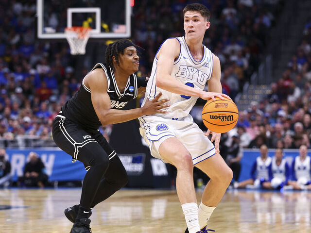 DENVER, COLORADO - MARCH 20: Egor Demin #3 of the Brigham Young Cougars is defended by Phillip Russell #1 of the Virginia Commonwealth Rams during the first round of the 2025 NCAA Men's Basketball Tournament held at Ball Arena on March 20, 2025 in Denver, Colorado.