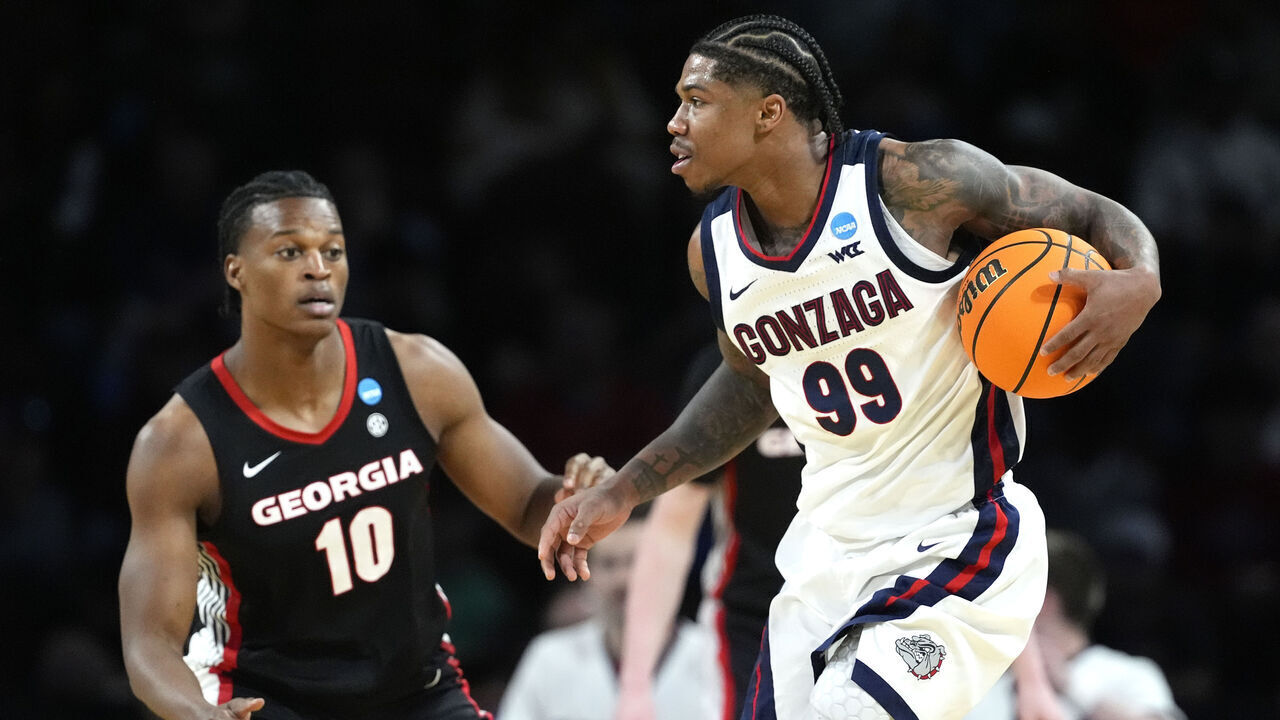 WICHITA, KANSAS - MARCH 20: Khalif Battle #99 of the Gonzaga Bulldogs dribbles the ball against RJ Godfrey #10 of the Georgia Bulldogs during the second half in the first round of the NCAA Men's Basketball Tournament at INTRUST Arena on March 20, 2025 in Wichita, Kansas.