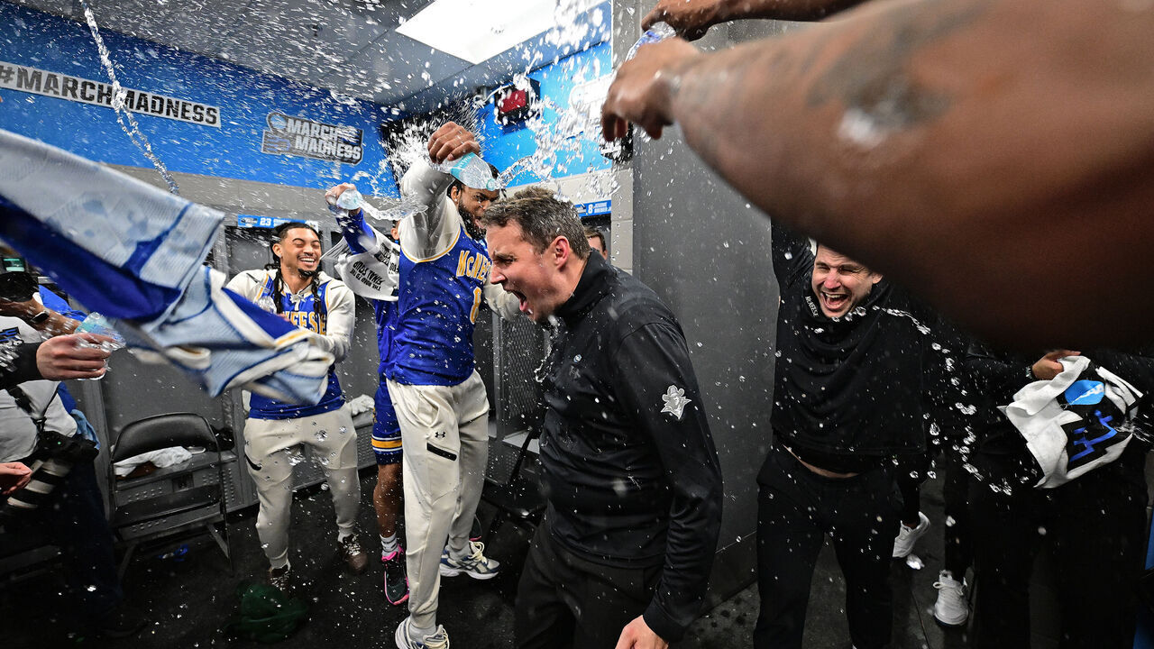 PROVIDENCE, RHODE ISLAND - MARCH 20: McNeese Cowboys players shower head coach Will Wade to celebrates the team's win over the Clemson University Tigers during the first round of the 2025 NCAA Men's Basketball Tournament held at Amica Mutual Pavillion on March 20, 2025 in Providence, Rhode Island.