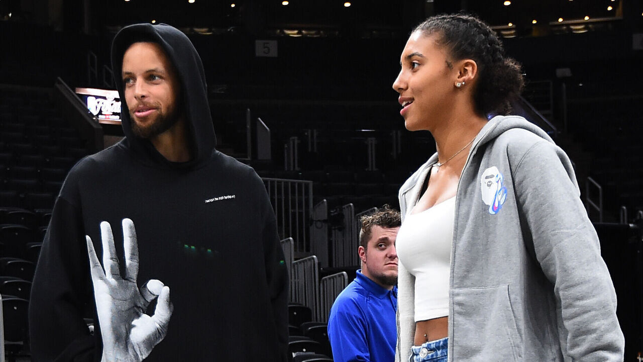 BOSTON, MA - JUNE 10: Stephen Curry #30 of the Golden State Warriors talks with UCONN players, Paige Bueckers and Azzi Fudd after Game Four of the 2022 NBA Finals on June 10, 2022 at TD Garden in Boston, Massachusetts. NOTE TO USER: User expressly acknowledges and agrees that, by downloading and or using this photograph, user is consenting to the terms and conditions of Getty Images License Agreement. Mandatory Copyright Notice: Copyright 2022 NBAE