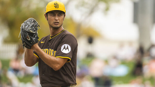 SURPRISE, ARIZONA - MARCH 13: Yu Darvish #11 of the San Diego Padres pitches during a spring training game against the Kansas City Royals at Surprise Stadium on March 13, 2025 in Surprise, Arizona.