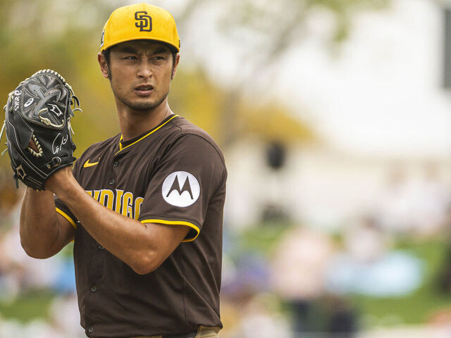 SURPRISE, ARIZONA - MARCH 13: Yu Darvish #11 of the San Diego Padres pitches during a spring training game against the Kansas City Royals at Surprise Stadium on March 13, 2025 in Surprise, Arizona.