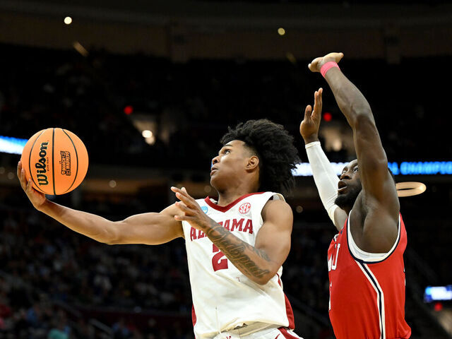 CLEVELAND, OHIO - MARCH 21: Aden Holloway #2 of the Alabama Crimson Tide shoots the ball against the Robert Morris Colonials during the second half in the first round of the NCAA Men's Basketball Tournament at Rocket Mortgage Fieldhouse on March 21, 2025 in Cleveland, Ohio.
