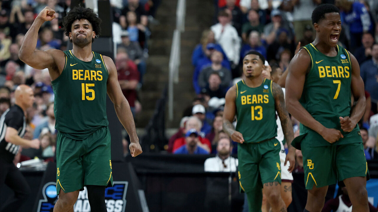 RALEIGH, NORTH CAROLINA - MARCH 21: Norchad Omier #15 of the Baylor Bears and VJ Edgecombe #7 celebrate at the end of the second half in the first round of the NCAA Men's Basketball Tournament at Lenovo Center on March 21, 2025 in Raleigh, North Carolina.