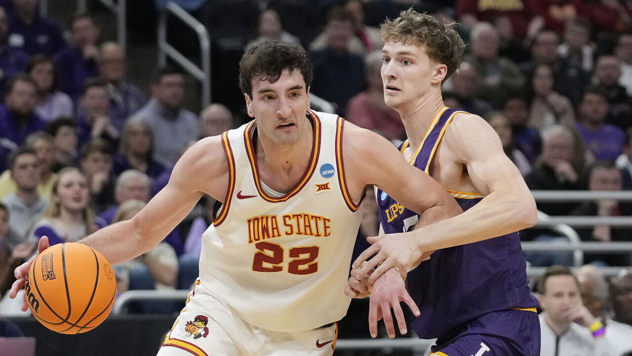 MILWAUKEE, WISCONSIN - MARCH 21: Milan Momcilovic #22 of the Iowa State Cyclones dribbles the ball against Kellan Boylan #23 of the Lipscomb Bisons during the first half in the first round of the NCAA Men's Basketball Tournament at Fiserv Forum on March 21, 2025 in Milwaukee, Wisconsin.
