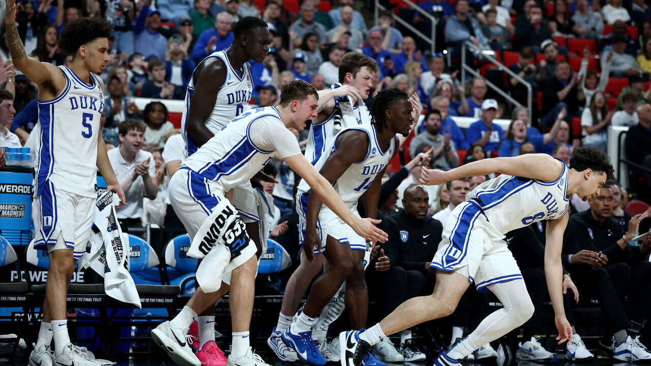 RALEIGH, NORTH CAROLINA - MARCH 21: Cooper Flagg #2 of the Duke Blue Devils and teammates react during the second half in the first round of the NCAA Men's Basketball Tournament against the Mount St. Mary's Mountaineers at Lenovo Center on March 21, 2025 in Raleigh, North Carolina.