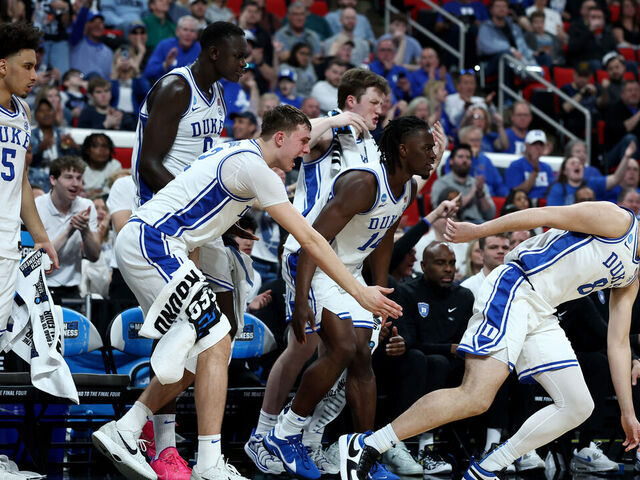 RALEIGH, NORTH CAROLINA - MARCH 21: Cooper Flagg #2 of the Duke Blue Devils and teammates react during the second half in the first round of the NCAA Men's Basketball Tournament against the Mount St. Mary's Mountaineers at Lenovo Center on March 21, 2025 in Raleigh, North Carolina.