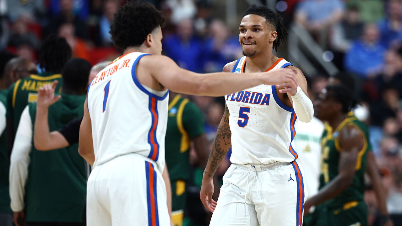 RALEIGH, NORTH CAROLINA - MARCH 21: Walter Clayton Jr. #1 and Will Richard #5 of the Florida Gators celebrate during the first half in the first round of the NCAA Men's Basketball Tournament against the Norfolk State Spartans at Lenovo Center on March 21, 2025 in Raleigh, North Carolina.