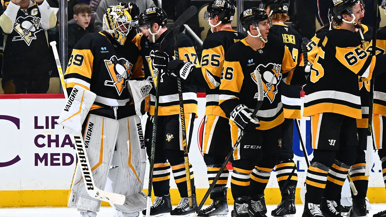 PITTSBURGH, PA - MARCH 21: Alex Nedeljkovic #39 of the Pittsburgh Penguins celebrates with teammates after defeating the Columbus Blue Jackets at PPG PAINTS Arena on March 21, 2025 in Pittsburgh, Pennsylvania.