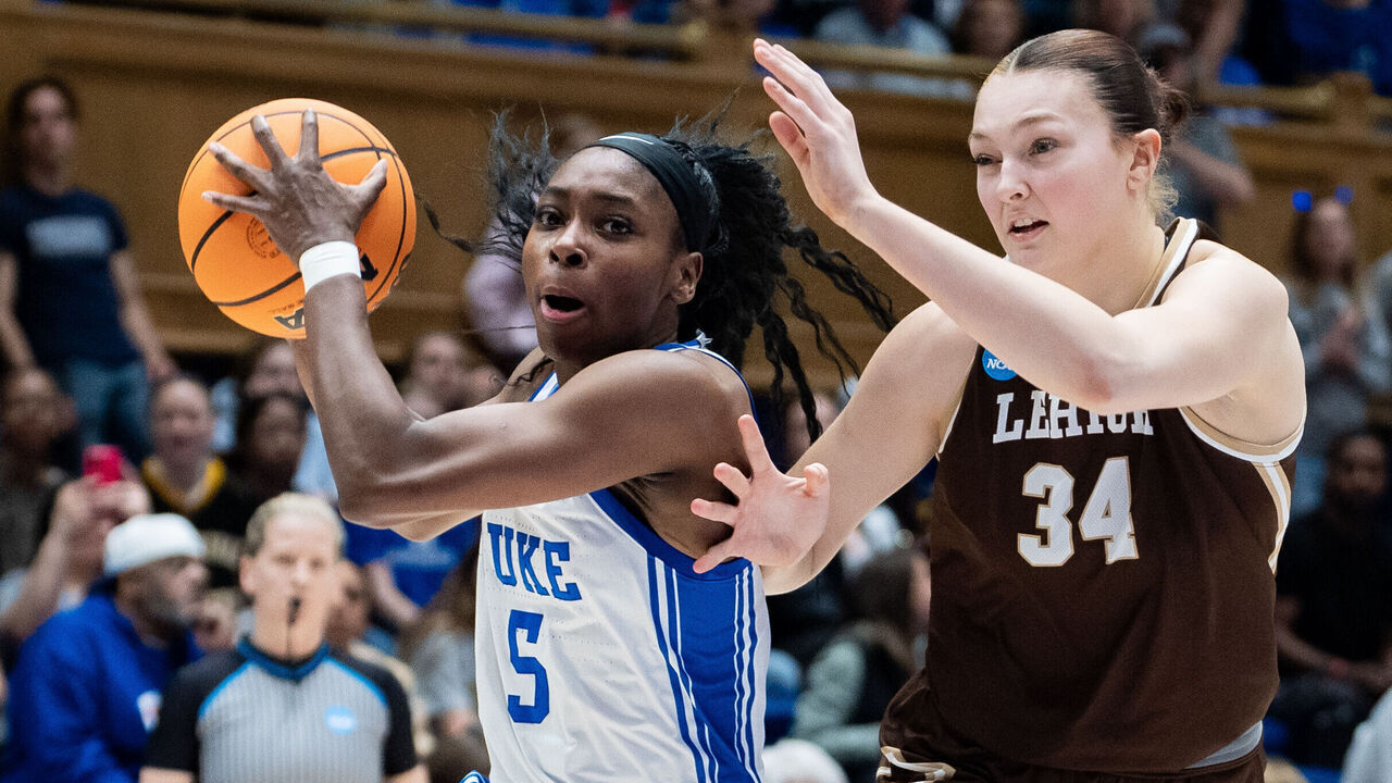 DURHAM, NORTH CAROLINA - MARCH 21: Oluchi Okananwa #5 of the Duke Blue Devils drives to the basket while guarded by Lily Fandre #34 of the Lehigh Mountain Hawks in the first half during a first round game of the women’s NCAA basketball tournament at Cameron Indoor Stadium on March 21, 2025 in Durham, North Carolina.