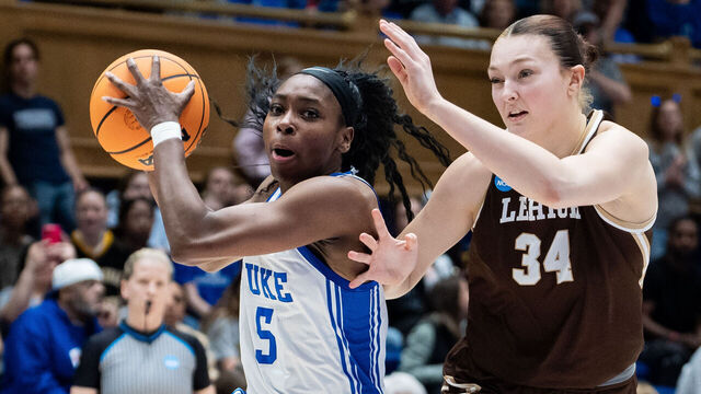 DURHAM, NORTH CAROLINA - MARCH 21: Oluchi Okananwa #5 of the Duke Blue Devils drives to the basket while guarded by Lily Fandre #34 of the Lehigh Mountain Hawks in the first half during a first round game of the women’s NCAA basketball tournament at Cameron Indoor Stadium on March 21, 2025 in Durham, North Carolina.