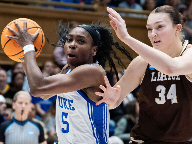 DURHAM, NORTH CAROLINA - MARCH 21: Oluchi Okananwa #5 of the Duke Blue Devils drives to the basket while guarded by Lily Fandre #34 of the Lehigh Mountain Hawks in the first half during a first round game of the women’s NCAA basketball tournament at Cameron Indoor Stadium on March 21, 2025 in Durham, North Carolina.