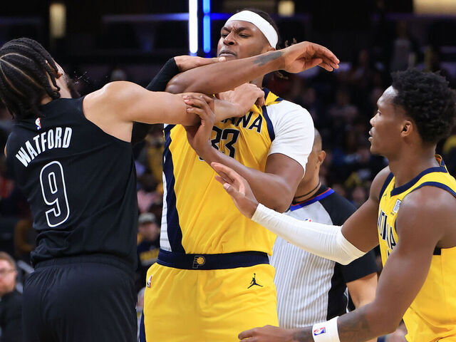 INDIANAPOLIS, INDIANA - MARCH 20: Trendon Watford #9 of the Brooklyn Nets and Myles Turner #33 of the Indiana Pacers get into an altercation during the second half at Gainbridge Fieldhouse on March 20, 2025 in Indianapolis, Indiana.