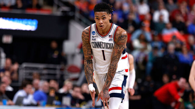 RALEIGH, NORTH CAROLINA - MARCH 21: Solo Ball #1 of the Connecticut Huskies reacts following a three-point basket against the Oklahoma Sooners in the first half during a first round game of the men's NCAA basketball tournament at Lenovo Center on March 21, 2025 in Raleigh, North Carolina.