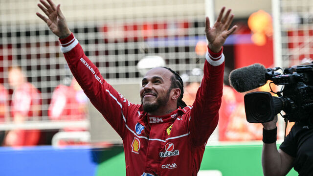 Ferrari's British driver Lewis Hamilton celebrates winning the sprint race of the Formula One Chinese Grand Prix at the Shanghai International Circuit in Shanghai on March 22, 2025.