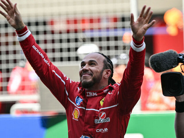 Ferrari's British driver Lewis Hamilton celebrates winning the sprint race of the Formula One Chinese Grand Prix at the Shanghai International Circuit in Shanghai on March 22, 2025.