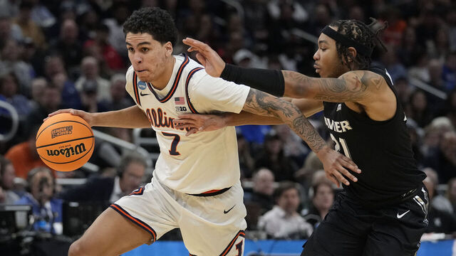 MILWAUKEE, WISCONSIN - MARCH 21: Will Riley #7 of the Illinois Fighting Illini dribbles the ball against Dante Maddox Jr. #21 of the Xavier Musketeers during the second half in the first round of the NCAA Men's Basketball Tournament at Fiserv Forum on March 21, 2025 in Milwaukee, Wisconsin.
