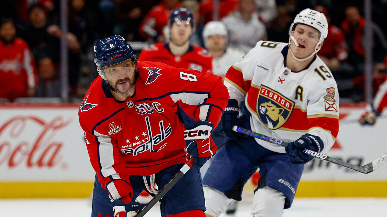 WASHINGTON, DC - FEBRUARY 4: Alex Ovechkin #8 of the Washington Capitals takes a shot for an empty net goal bringing his total goals to 878 during a game against the Florida Panthers at Capital One Arena on February 4, 2025 in Washington, D.C.