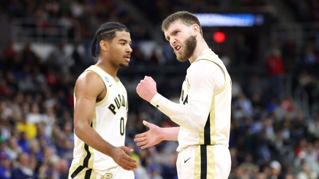 PROVIDENCE, RHODE ISLAND - MARCH 22: Braden Smith #3 and C.J. Cox #0 of the Purdue Boilermakers celebrate against the McNeese State Cowboys at halftime in the second round of the NCAA Men's Basketball Tournament at Amica Mutual Pavillion on March 22, 2025 in Providence, Rhode Island.