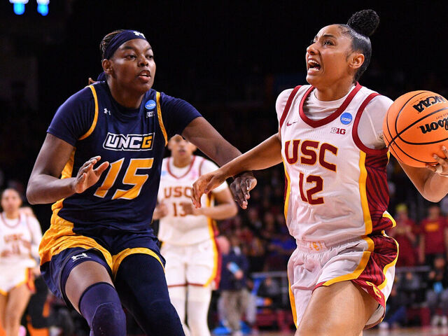 LOS ANGELES, CA - MARCH 22: USC Trojans guard JuJu Watkins (12) drives to the basket during the UNC Greensboro Spartans game versus the USC Trojans in the first round of the NCAA Division I Women's Championship on March 22, 2025, at the Galen Center in Los Angeles, CA.