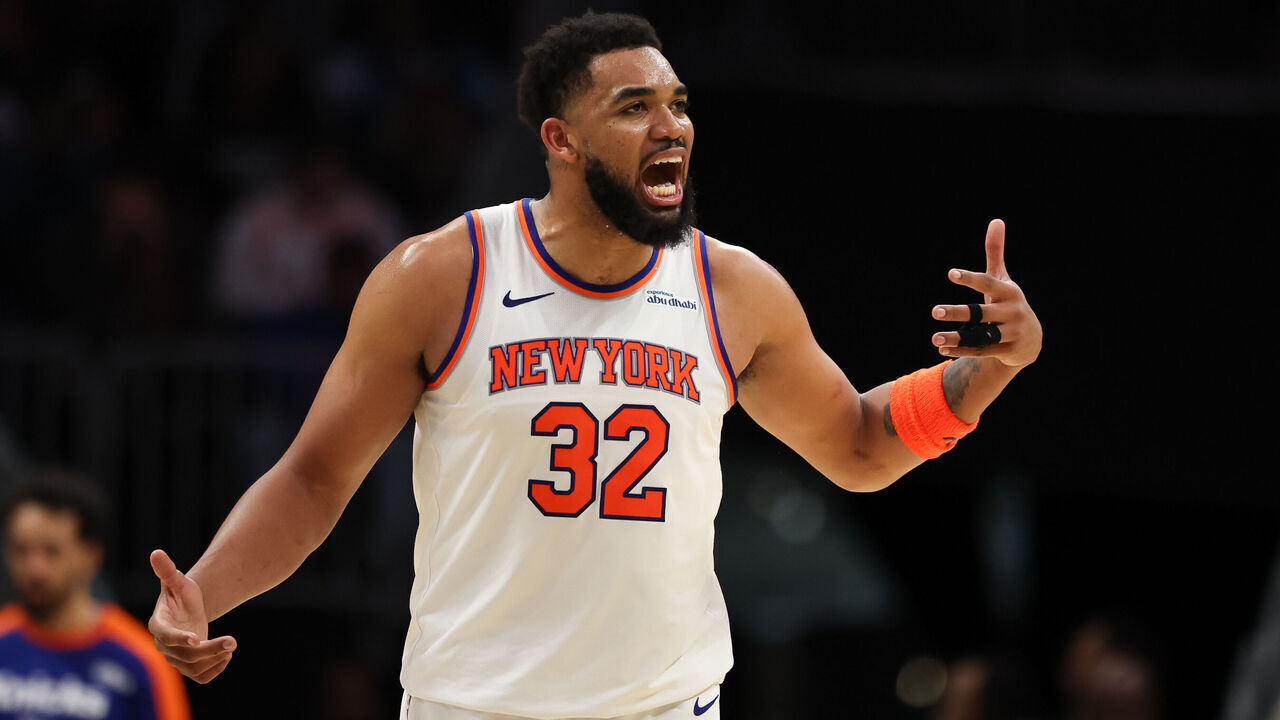 CHARLOTTE, NORTH CAROLINA - MARCH 20: Karl-Anthony Towns #32 of the New York Knicks reacts during the second half of a basketball game against the Charlotte Hornets at Spectrum Center on March 20, 2025 in Charlotte, North Carolina.
