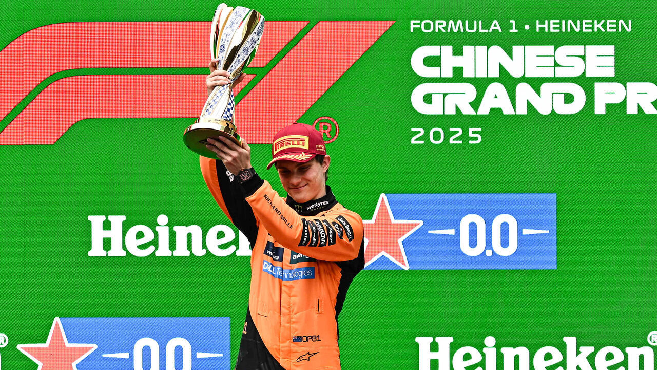 SHANGHAI, CHINA - MARCH 23: Race winner Oscar Piastri of Australia and McLaren lifts his trophy on the podium during the F1 Grand Prix of China at Shanghai International Circuit on March 23, 2025 in Shanghai, China.