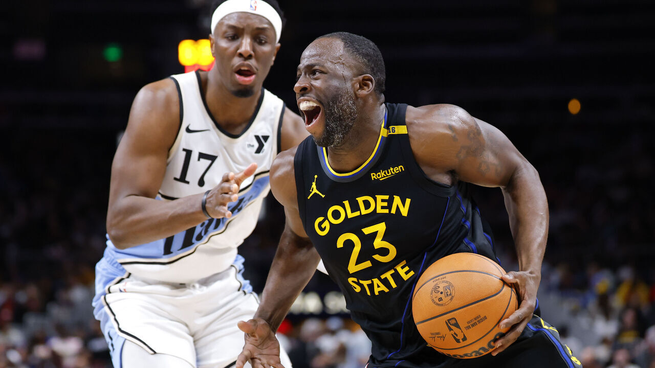 ATLANTA, GEORGIA - MARCH 22: Draymond Green #23 of the Golden State Warriors drives against Onyeka Okongwu #17 of the Atlanta Hawks during the third quarter at State Farm Arena on March 22, 2025 in Atlanta, Georgia.
