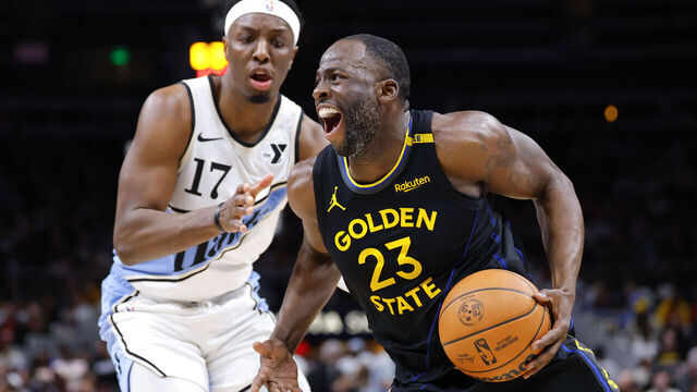 ATLANTA, GEORGIA - MARCH 22: Draymond Green #23 of the Golden State Warriors drives against Onyeka Okongwu #17 of the Atlanta Hawks during the third quarter at State Farm Arena on March 22, 2025 in Atlanta, Georgia.