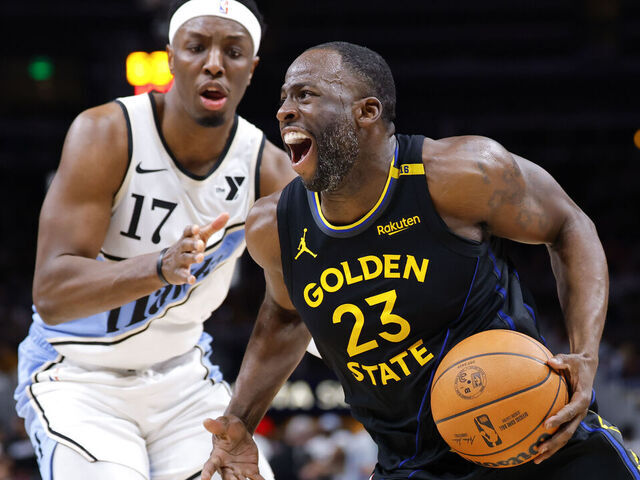 ATLANTA, GEORGIA - MARCH 22: Draymond Green #23 of the Golden State Warriors drives against Onyeka Okongwu #17 of the Atlanta Hawks during the third quarter at State Farm Arena on March 22, 2025 in Atlanta, Georgia.