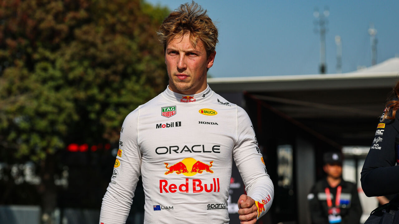 SHANGHAI, CHINA - MARCH 22: Liam Lawson of New Zealand and Oracle Red Bull Racing walks in the paddock during the Sprint/qualifying ahead of the F1 Grand Prix of China at Shanghai International Circuit on March 22, 2025 in Shanghai, China.
