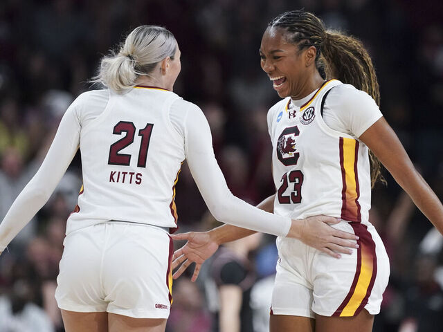 COLUMBIA, SOUTH CAROLINA - MARCH 23: Bree Hall #23 and Chloe Kitts #21 of the South Carolina Gamecocks celebrate a Kitt's three-pointer during the second half of a second round game against the Indiana Hoosiers in the NCAA Women's basketball tournament on March 23, 2025 in Columbia, South Carolina. The South Carolina Gamecocks won 64-53.