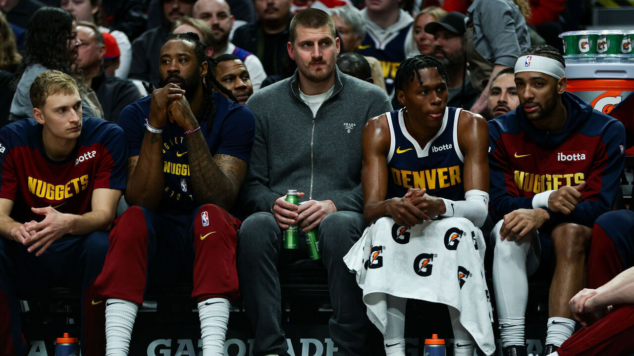PORTLAND, OREGON - MARCH 21: Nikola Jokic #15 of the Denver Nuggets looks on from the bench during the second quarter of a game against the Portland Trail Blazers at the Moda Center on March 21, 2025 in Portland, Oregon.