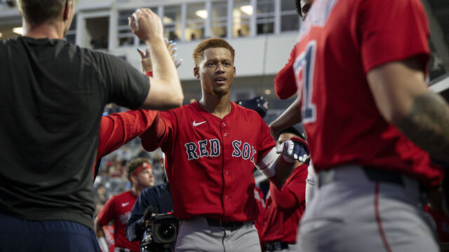 PORT CHARLOTTE, FLORIDA - MARCH 13: Kristian Campbell #28 of the Boston Red Sox reacts in the dugout after hitting a home run during a 2025 MLB Spring Breakout game against the Tampa Bay Rays at Charlotte Sports Park on March 13, 2025 in Port Charlotte, Florida.