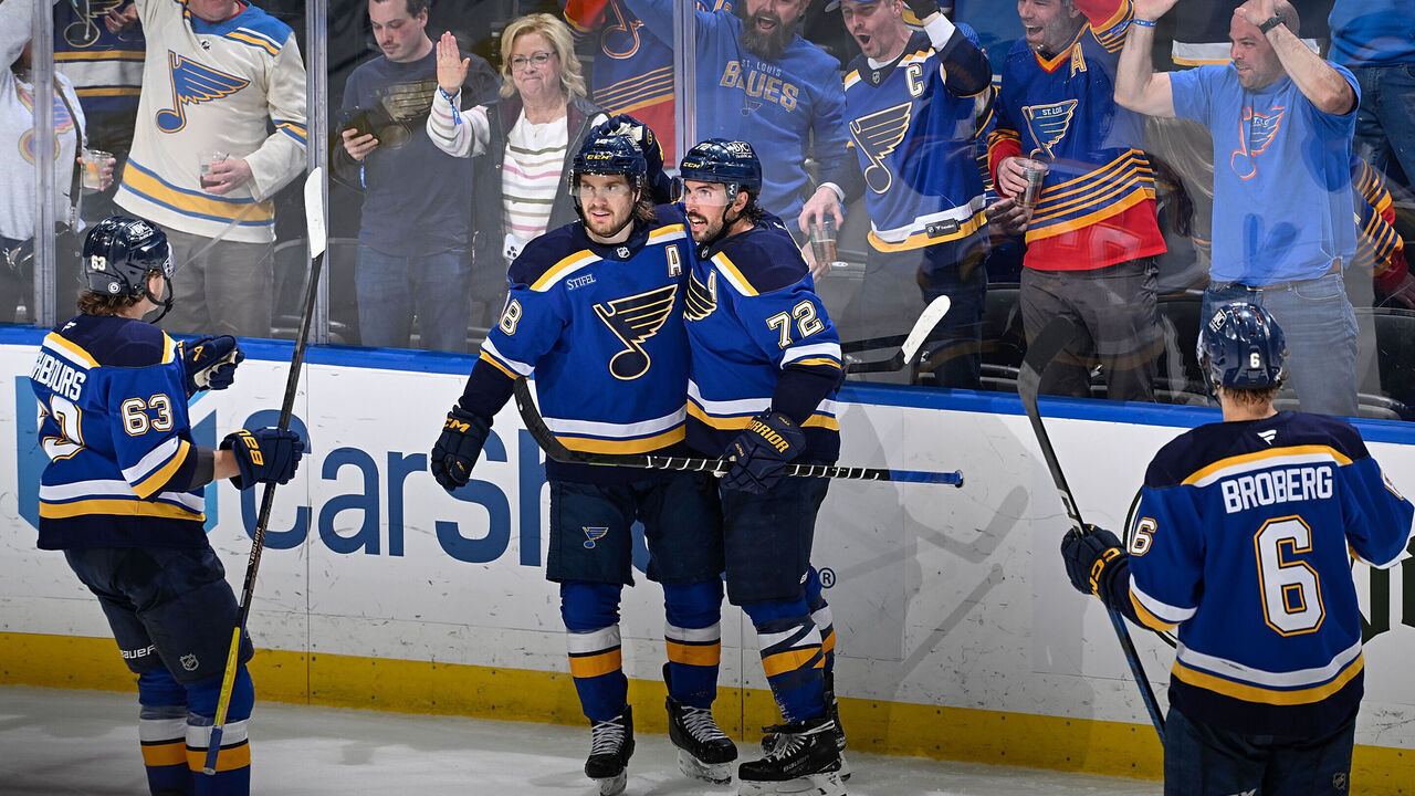 ST. LOUIS, MO - MARCH 23: Justin Faulk #72 of the St. Louis Blues is congratulated after scoring against the Nashville Predators on March 23, 2025 at the Enterprise Center in St. Louis, Missouri.