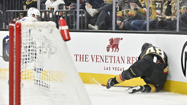LAS VEGAS, NEVADA - MARCH 23: Tomas Hertl #48 of the Vegas Golden Knights crashes into the boards after a shove from Emil Lilleberg #78 of the Tampa Bay Lightning \d3p at T-Mobile Arena on March 23, 2025 in Las Vegas, Nevada.