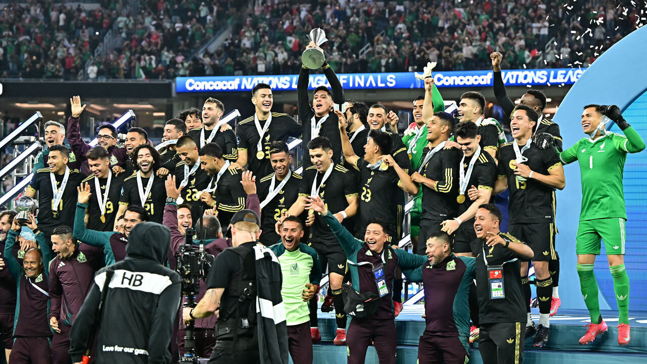 Mexico players celebrate on the podium with the Concacaf Nations League Cup after winning the CONCACAF Nations League final football match against Panama at SoFi Stadium in Inglewood, California, on March 23, 2025.